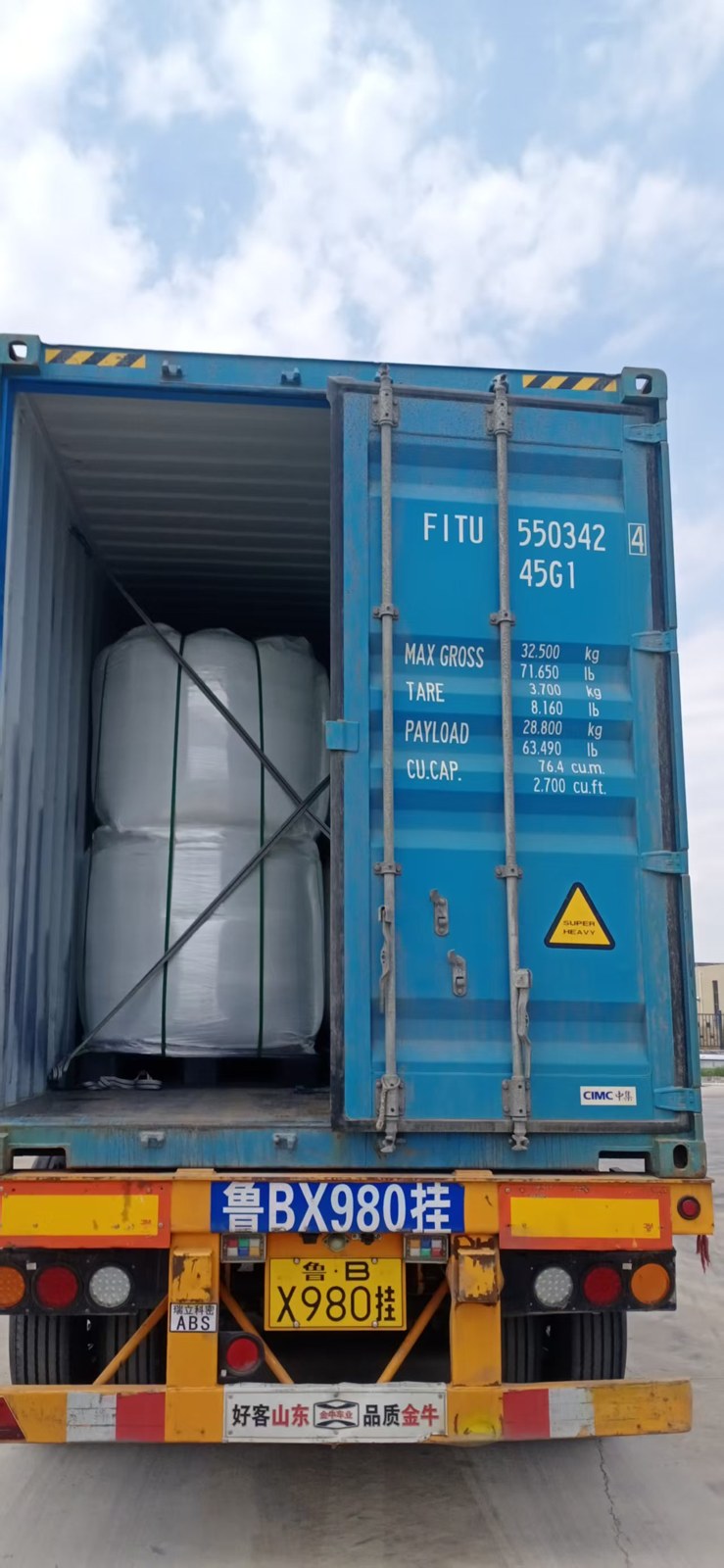 PMMA resin bulk bags inside a blue shipping container