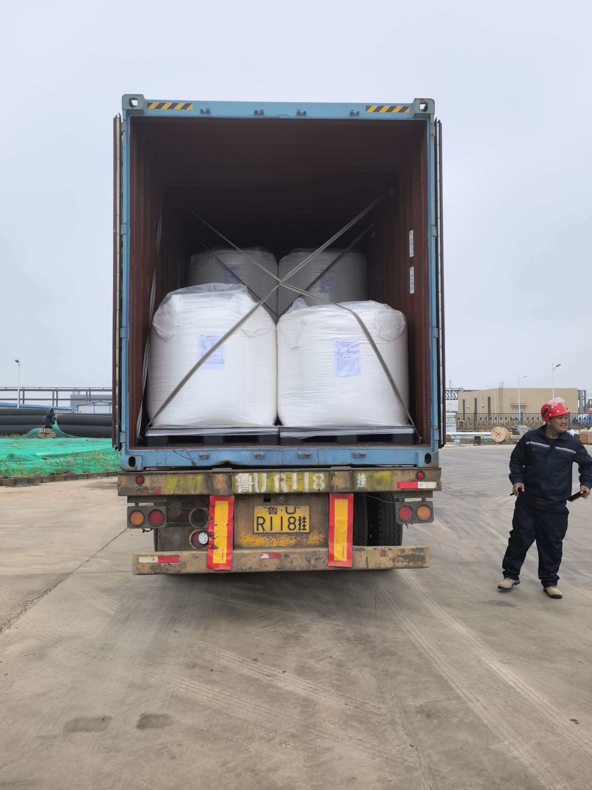 Loaded PMMA resin bulk bags secured in a shipping container at dispatch